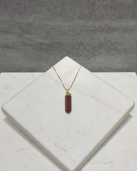 Pingente ponta biterminada goldstone marrom banho ouro