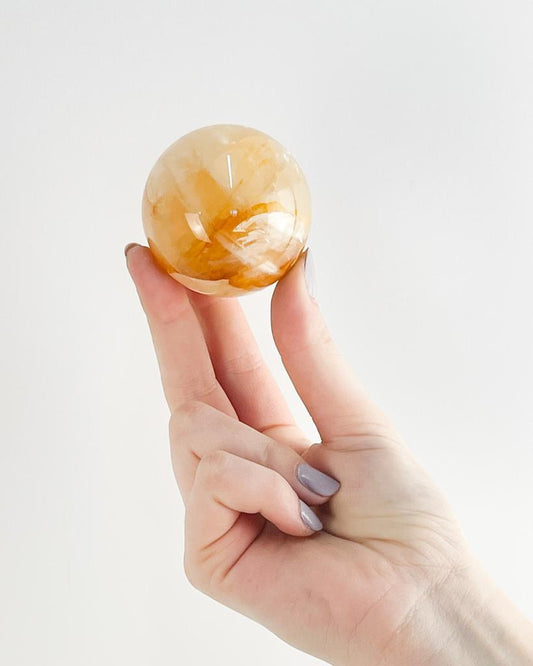 Bola Quartzo Agente Cura Ouro 5,5 cm aprox.